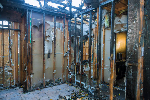 Professional Fire Damage Restoration technician working in Midland, WA